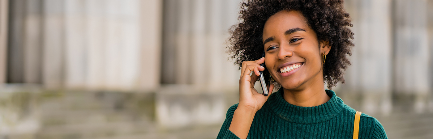 Woman in sweater talking on cell phone