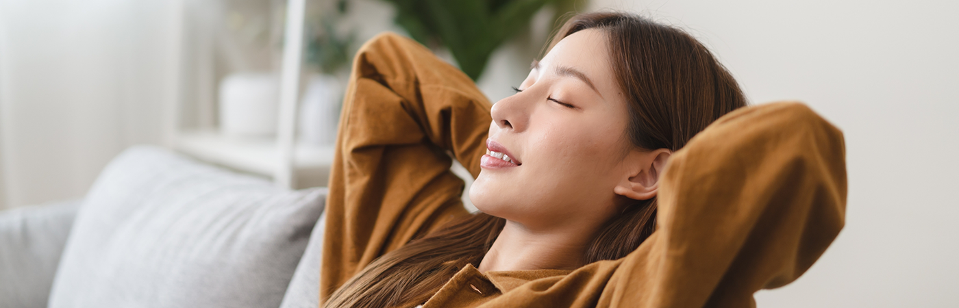 Woman sitting back in couch relaxing